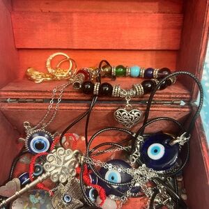 Trinket box of fashion jewelry, crystals and all seeing eye jewelry